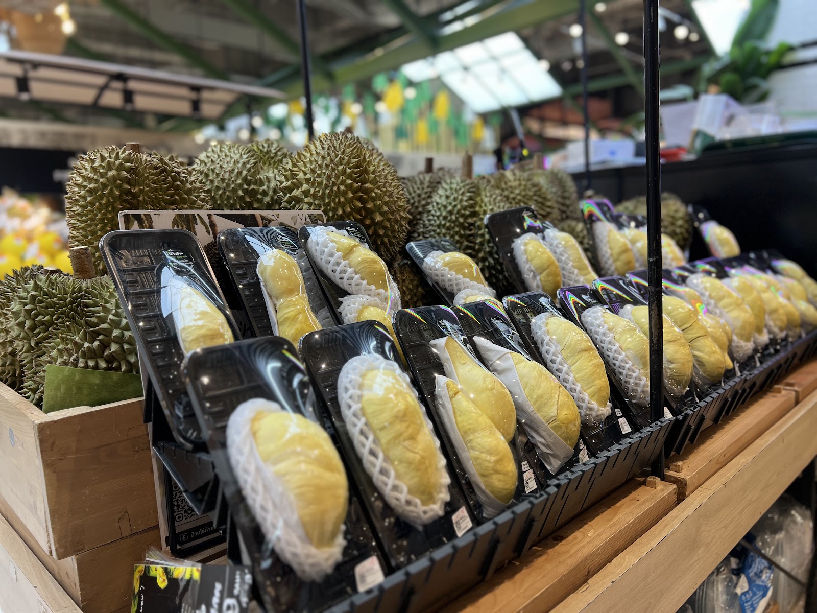 Exotic imported fruits displayed on a clean, modern shelf