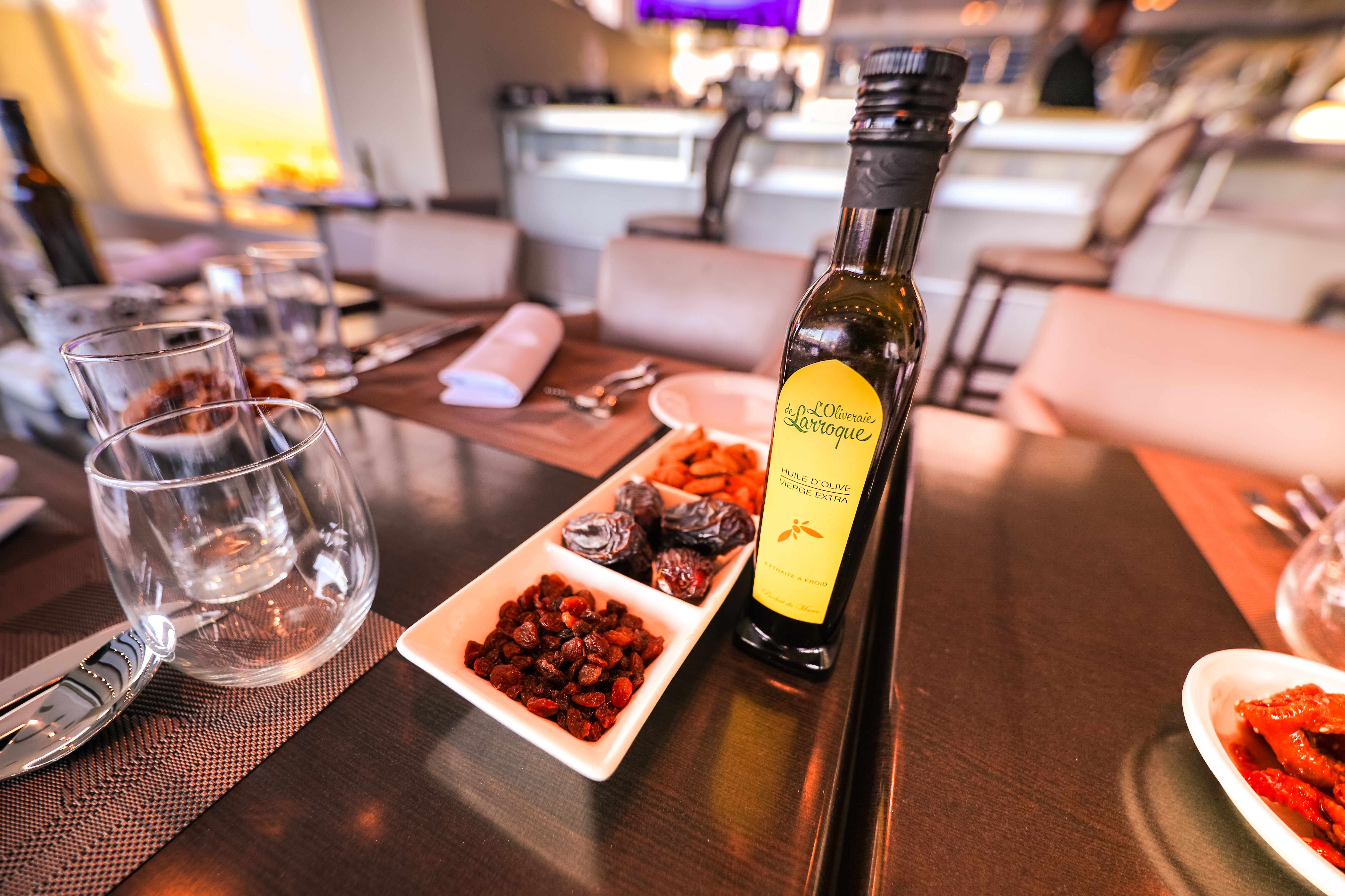 A collection of imported olive oils and balsamic vinegars on a shelf