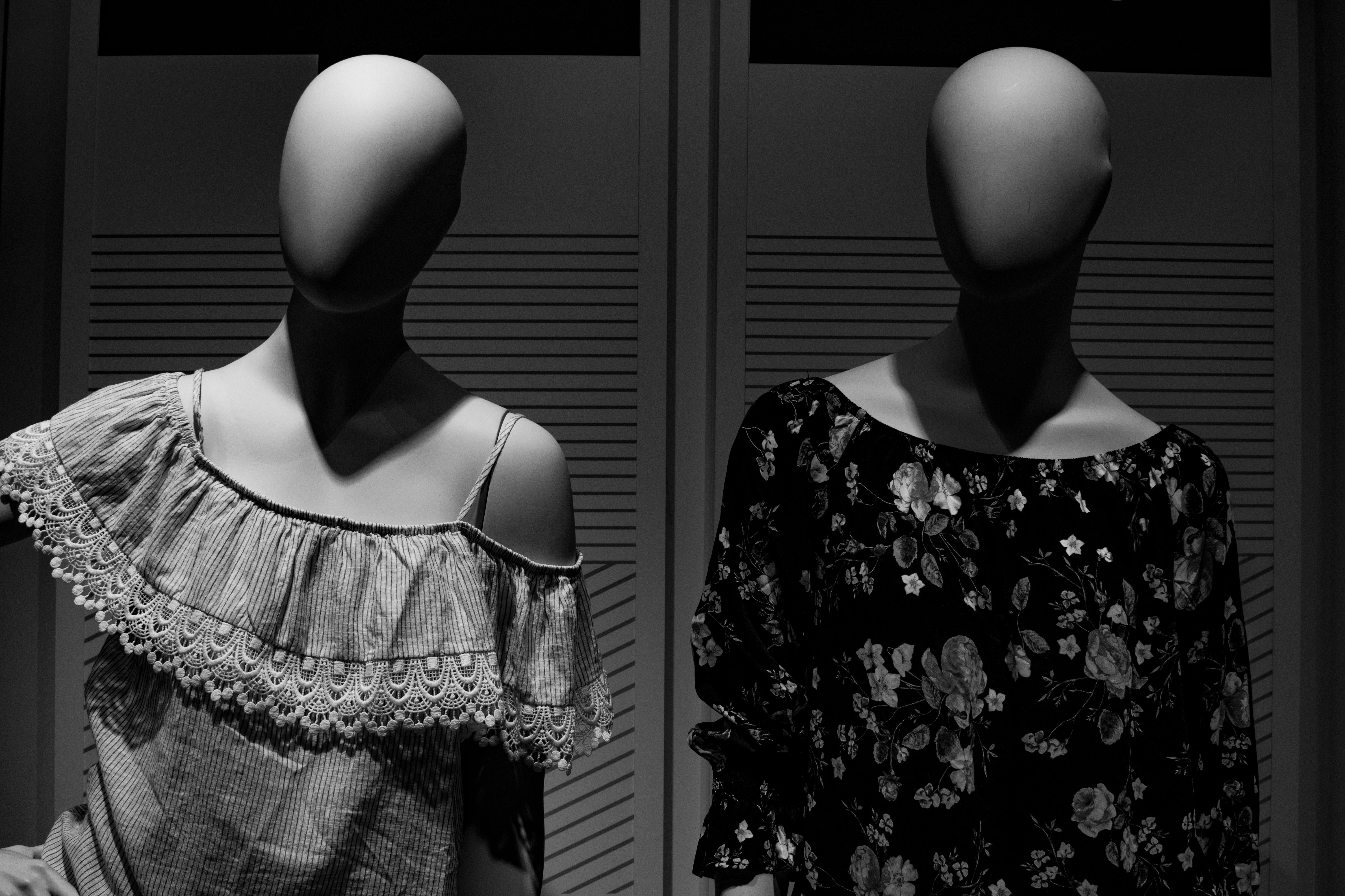 Elegant vintage dress on a mannequin in a sunlit corner