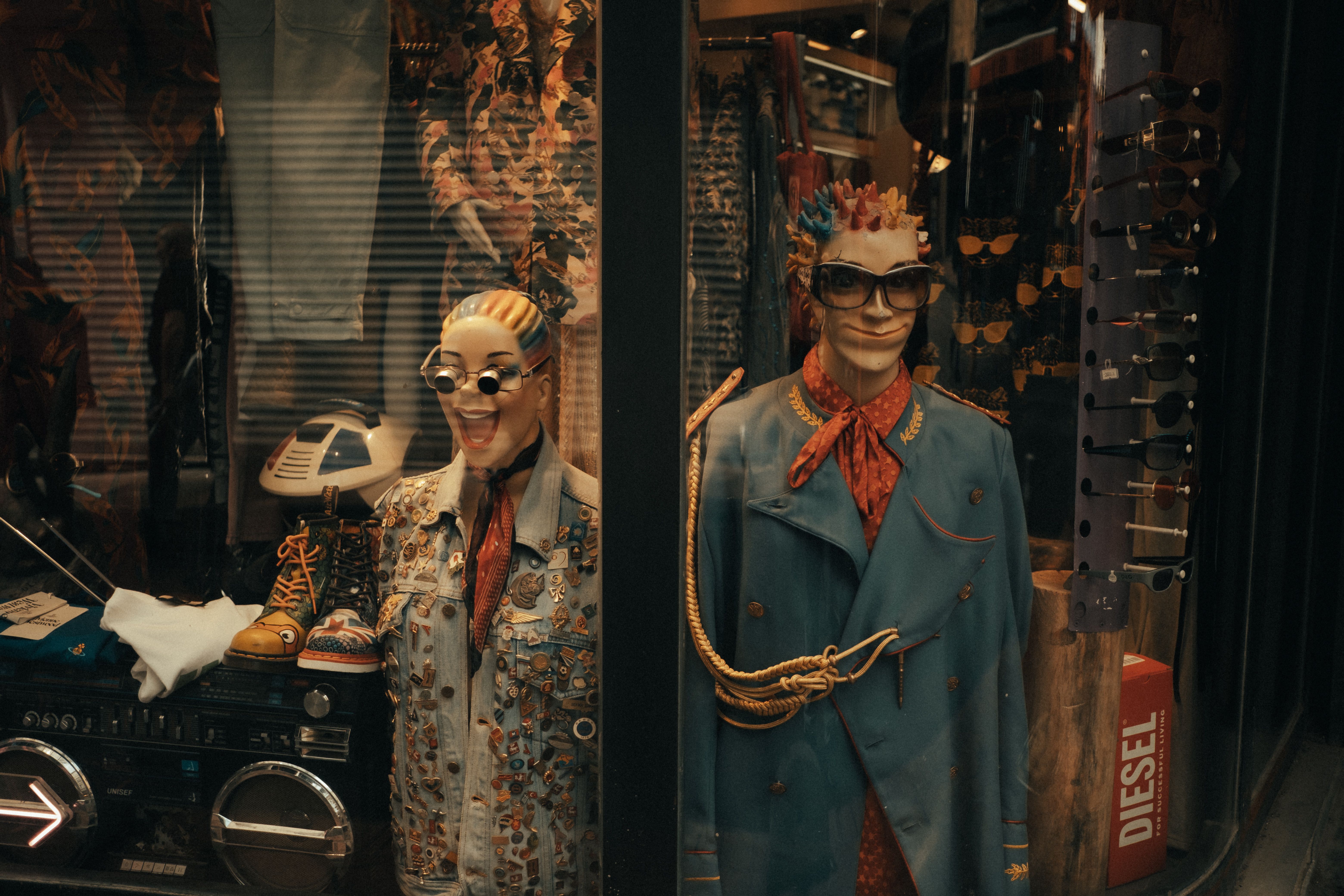 Two female entrepreneurs smiling inside a vintage clothing store