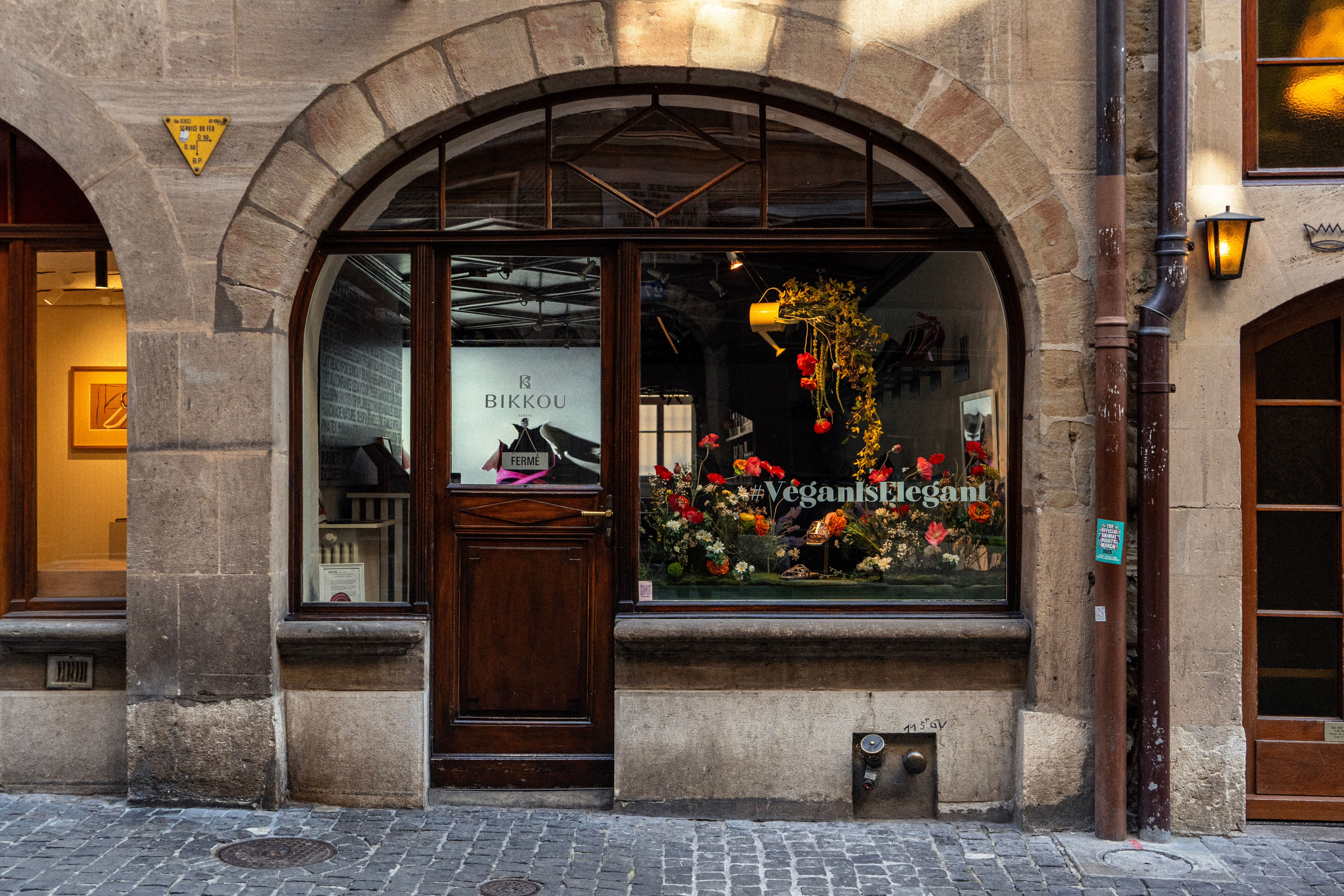 Charming boutique entrance with a vintage sign on a traditional Lisbon street