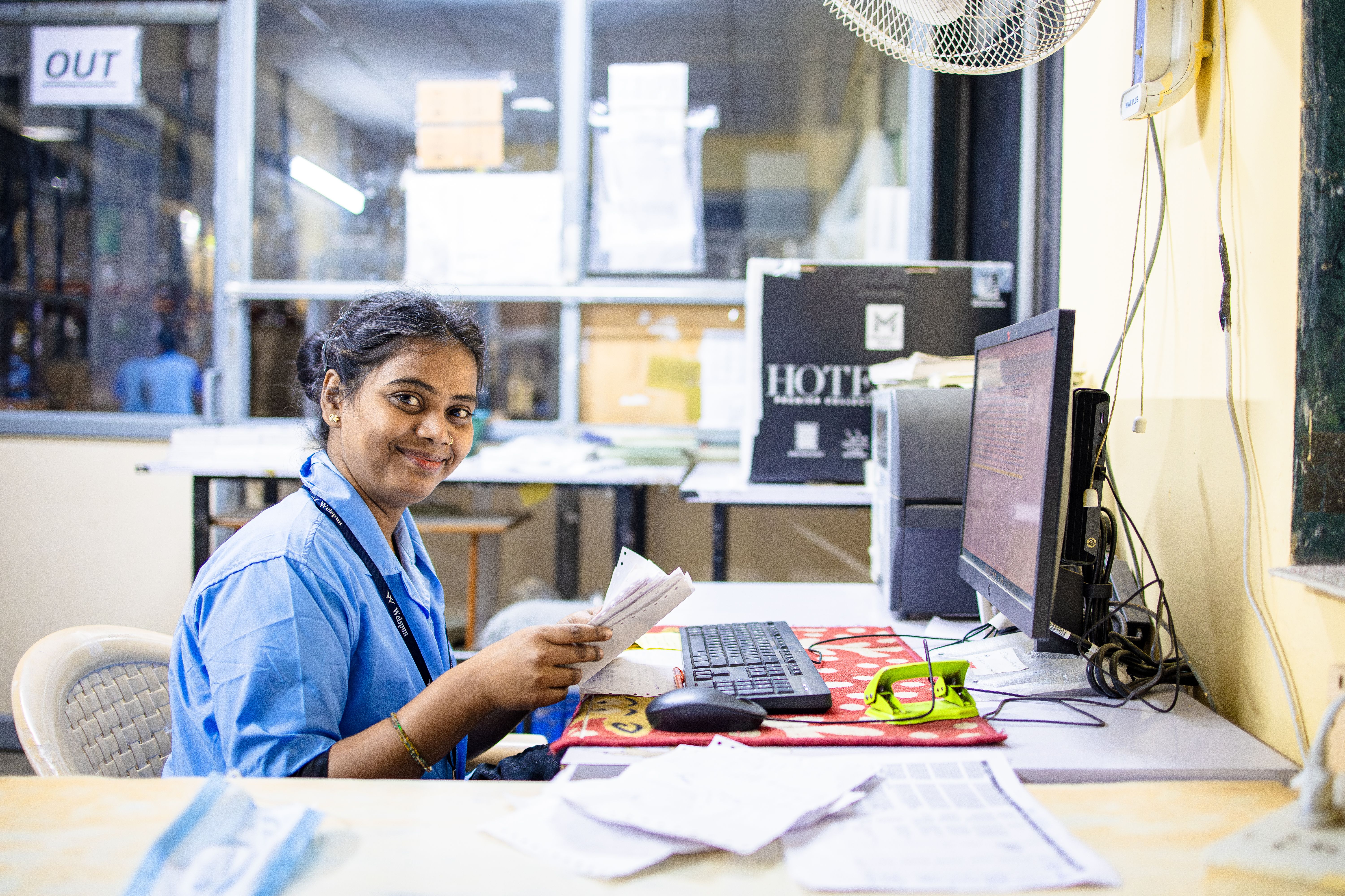 Friendly office worker smiling in a bright reception area