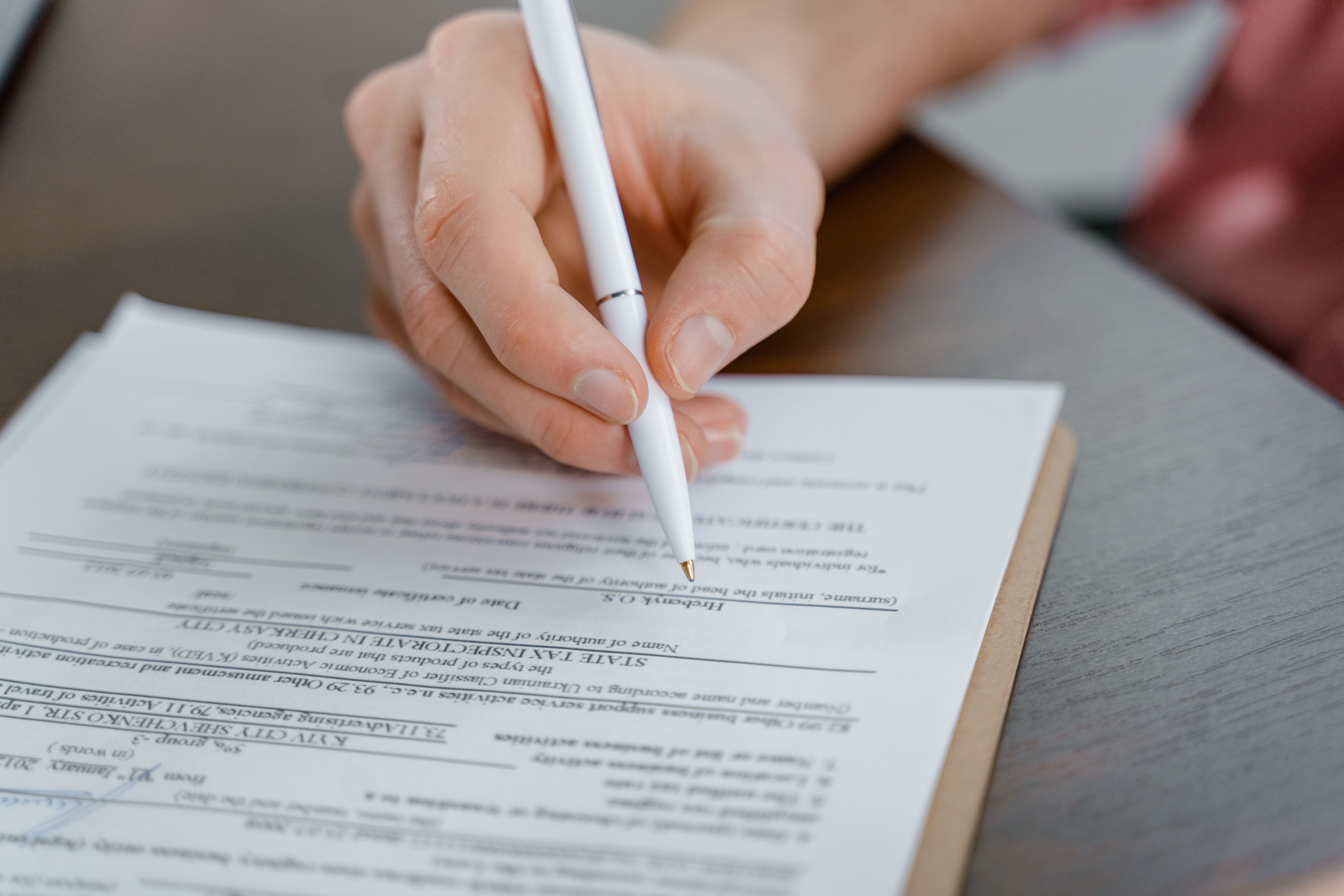 Close-up of a fountain pen on a financial document