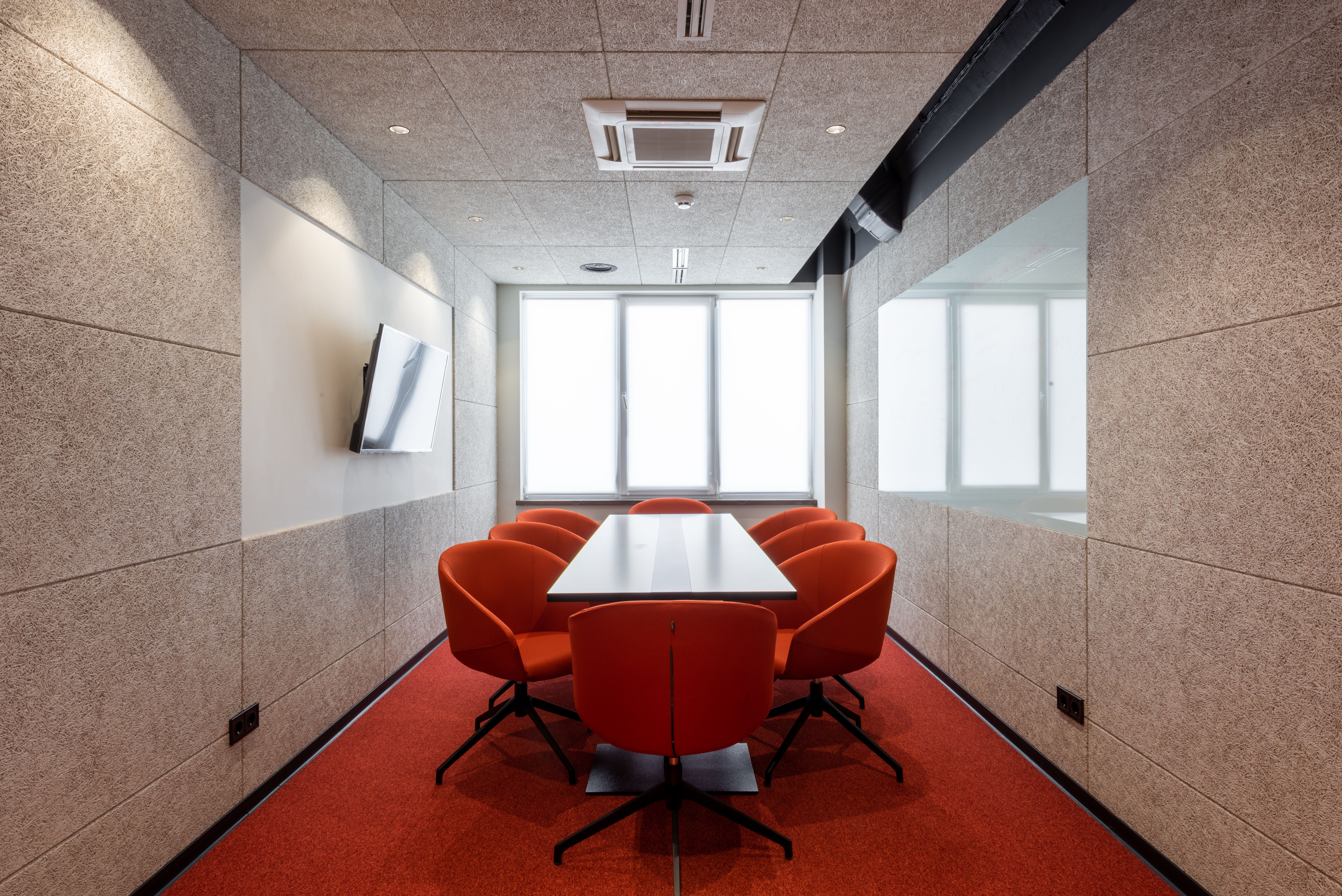 Meeting room with a large table and leather chairs