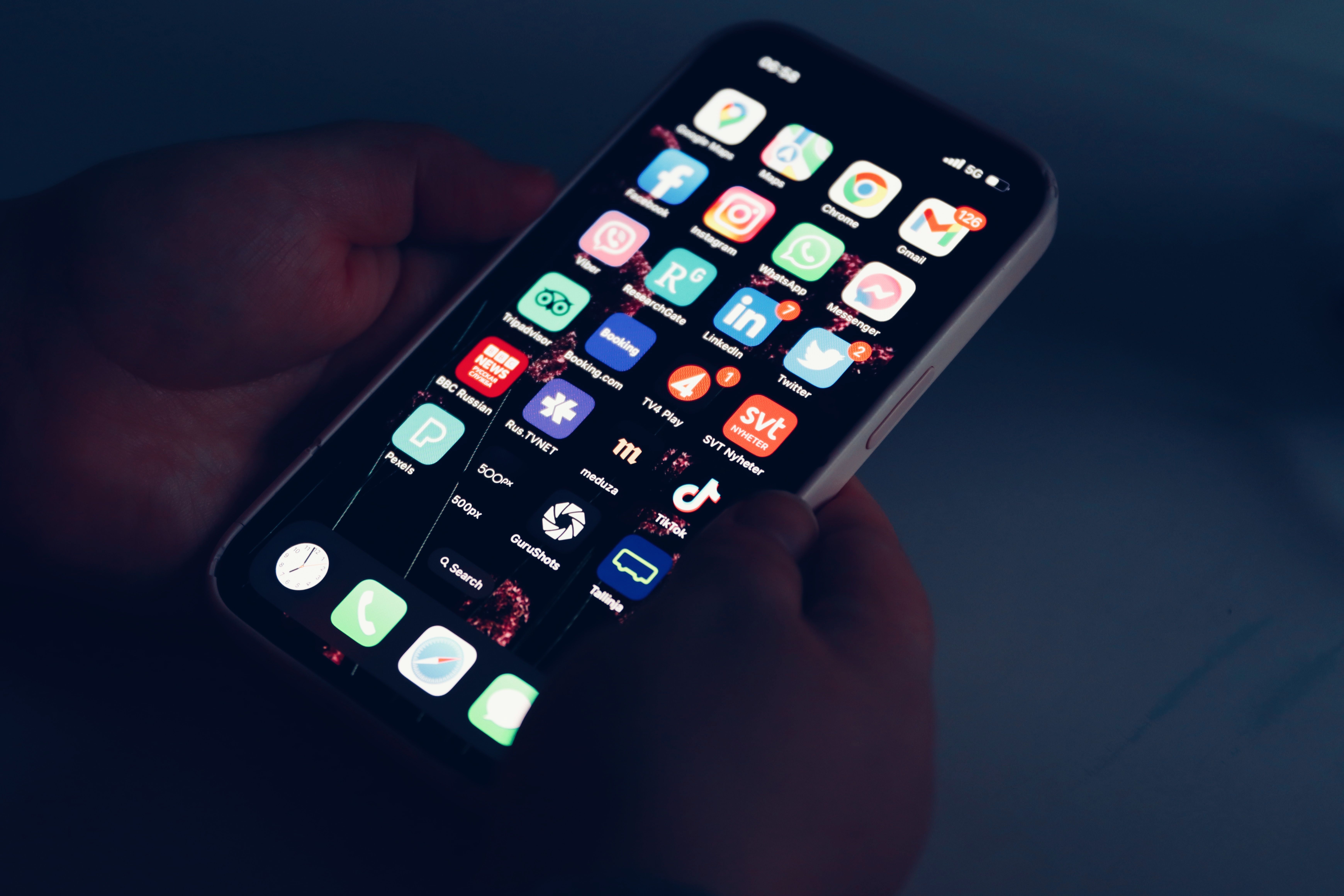 A person holding a smartphone showing a financial app