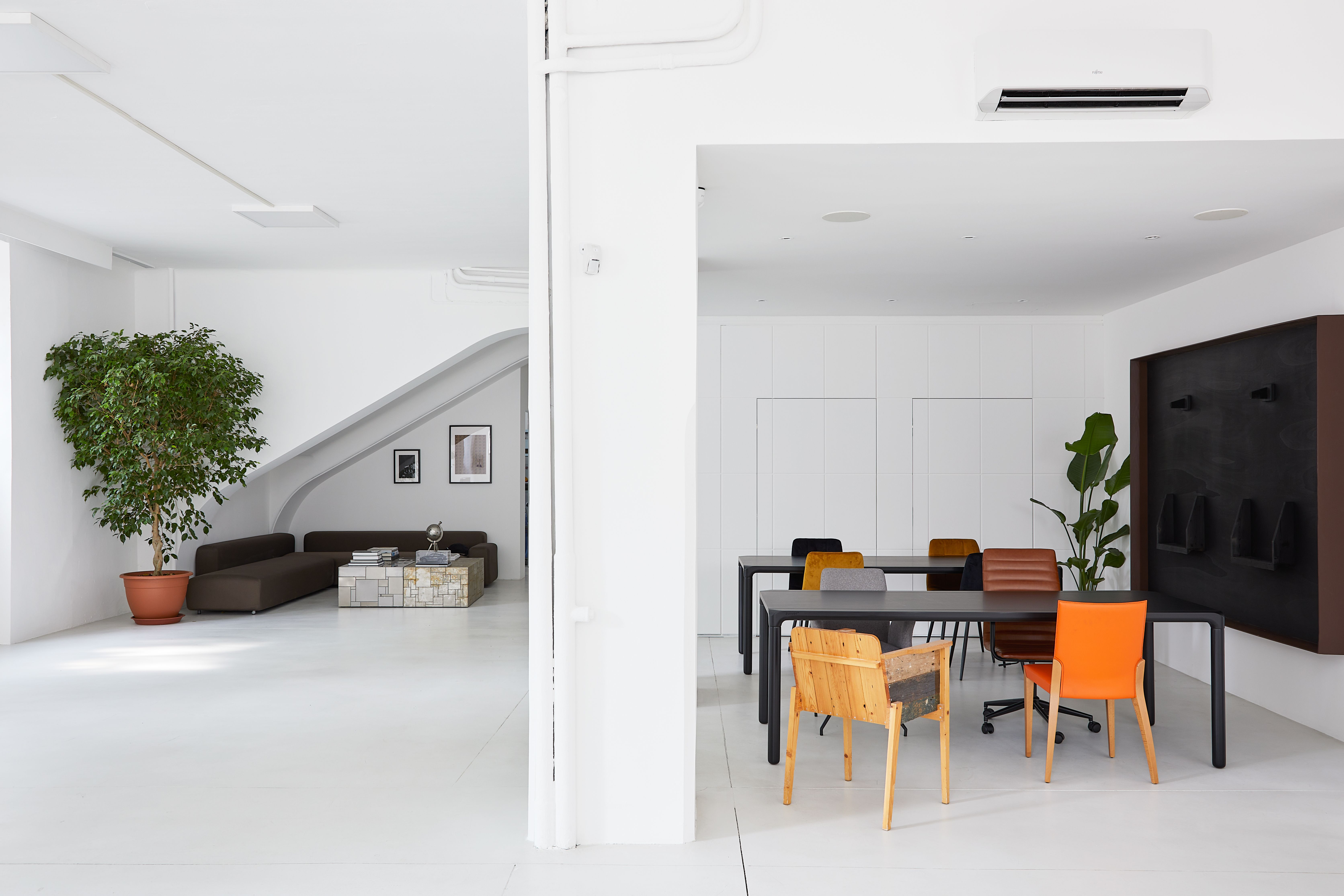 Modern office interior with bright windows and plants