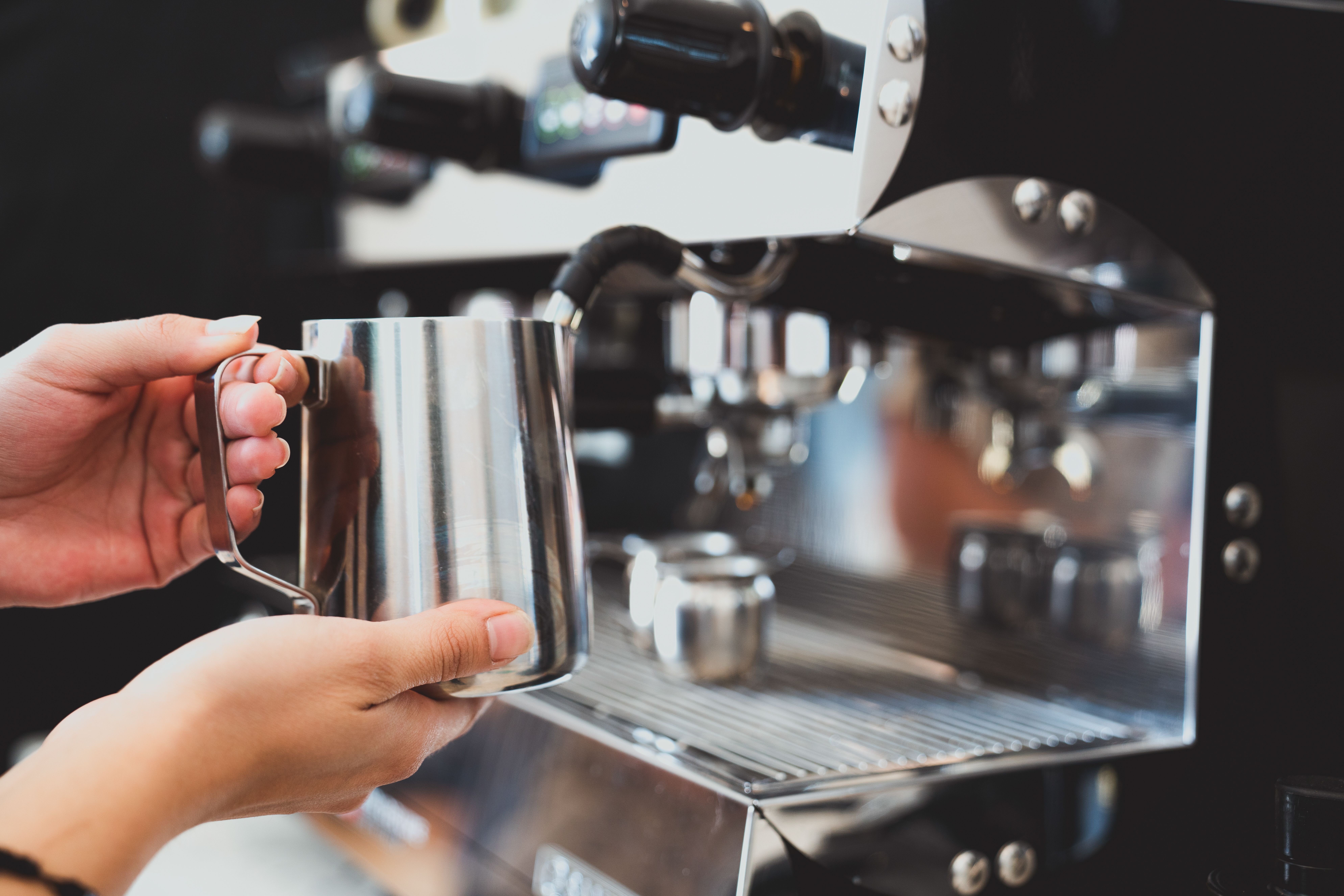 Professional espresso machine in action