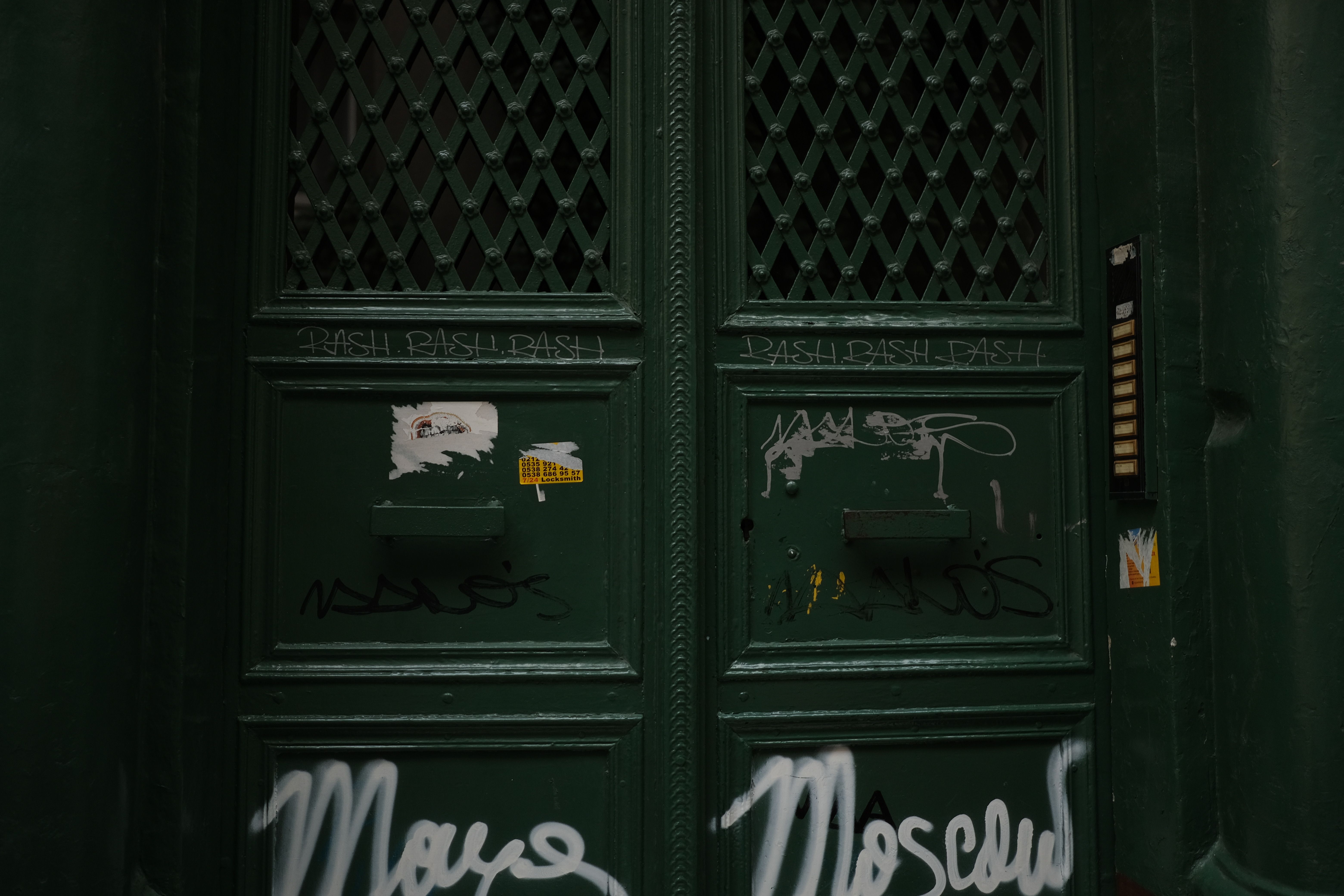 A welcoming open door of a boutique with a warm interior glow and inclusive signage.