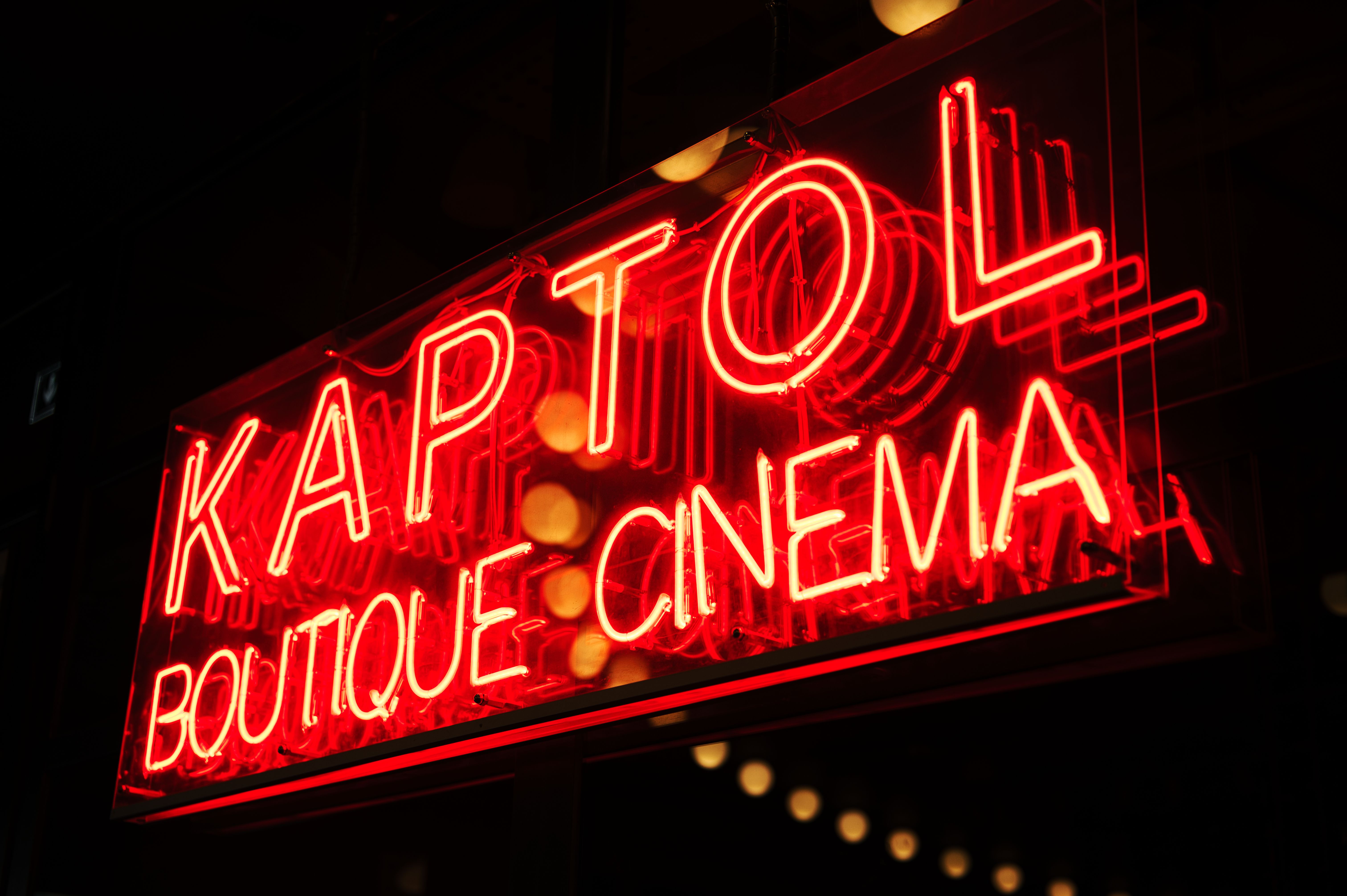 Interior of the shop showing neon signs and vintage decor elements.